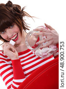 spicy woman eating marshmallow. Стоковое фото, агентство Ingram Publishing / Фотобанк Лори