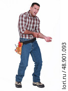 Builder with a sore arm. Стоковое фото, агентство Ingram Publishing / Фотобанк Лори