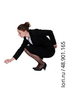 Businesswoman picking up a needle. Стоковое фото, агентство Ingram Publishing / Фотобанк Лори