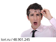 Man taking his glasses off. Стоковое фото, агентство Ingram Publishing / Фотобанк Лори