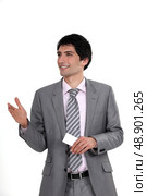 Executive offering a handshake and business card. Стоковое фото, агентство Ingram Publishing / Фотобанк Лори