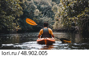 A man in a kayak paddling down a river, surrounded by lush greenery on the riverbanks under a clear sky. Стоковое AI-изображение, AI-художник Данила Большаков / Фотобанк Лори