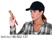 Woman holding a paintbrush. Стоковое фото, агентство Ingram Publishing / Фотобанк Лори