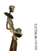 Tribal figurine holding drum. Стоковое фото, агентство Ingram Publishing / Фотобанк Лори