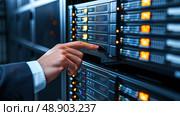 A person is interacting with a server panel that is illuminated by yellow lights, possibly performing maintenance or troubleshooting. Стоковое AI-изображение, AI-художник Данила Большаков / Фотобанк Лори