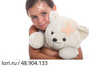 Girl and teddy with a plaster. Стоковое фото, агентство Ingram Publishing / Фотобанк Лори