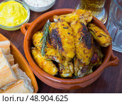 Roasted chicken wings in clayware. Стоковое фото, фотограф Яков Филимонов / Фотобанк Лори
