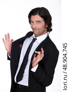 Businessman holding jacket open. Стоковое фото, агентство Ingram Publishing / Фотобанк Лори