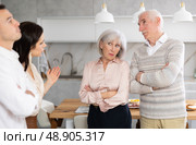 Young girl introducing her boyfriend to her discontented parents at home. Стоковое фото, фотограф Яков Филимонов / Фотобанк Лори