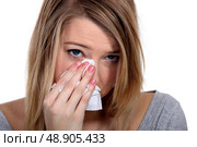 Young blond woman crying. Стоковое фото, агентство Ingram Publishing / Фотобанк Лори
