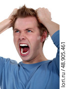 picture of young man going wild. Стоковое фото, агентство Ingram Publishing / Фотобанк Лори