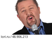 would be male singer with microphone. Стоковое фото, агентство Ingram Publishing / Фотобанк Лори