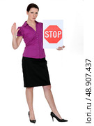 Woman with a stop sign. Стоковое фото, агентство Ingram Publishing / Фотобанк Лори