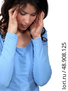 Woman suffering from a headache. Стоковое фото, агентство Ingram Publishing / Фотобанк Лори