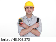 Electrician with voltmeter. Стоковое фото, агентство Ingram Publishing / Фотобанк Лори