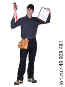 Man with a wrench and a clipboard. Стоковое фото, агентство Ingram Publishing / Фотобанк Лори