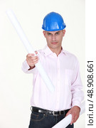 businessman holding a blueprint. Стоковое фото, агентство Ingram Publishing / Фотобанк Лори