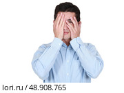 Man covering his eyes with his hands. Стоковое фото, агентство Ingram Publishing / Фотобанк Лори