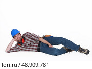 Tradesman on the ground. Стоковое фото, агентство Ingram Publishing / Фотобанк Лори