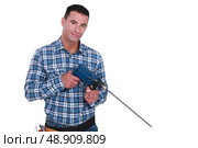 Man with a masonry drill. Стоковое фото, агентство Ingram Publishing / Фотобанк Лори