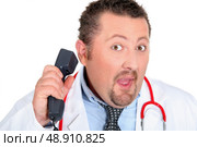 Funny doctor with a telephone. Стоковое фото, агентство Ingram Publishing / Фотобанк Лори