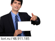Businessman pointing at a notebook. Стоковое фото, агентство Ingram Publishing / Фотобанк Лори