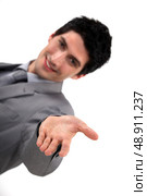 young handsome businessman reaching out his hand. Стоковое фото, агентство Ingram Publishing / Фотобанк Лори