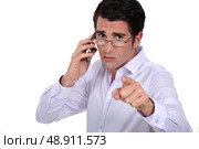 A boss blaming one of his employee. Стоковое фото, агентство Ingram Publishing / Фотобанк Лори