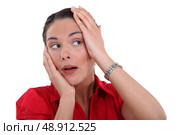 Woman touching her head. Стоковое фото, агентство Ingram Publishing / Фотобанк Лори