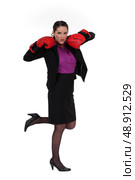 Office worker in heels and boxing gloves. Стоковое фото, агентство Ingram Publishing / Фотобанк Лори