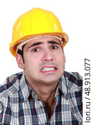 Portrait of scared laborer. Стоковое фото, агентство Ingram Publishing / Фотобанк Лори