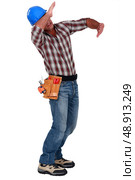 Tradesman blocking a blow. Стоковое фото, агентство Ingram Publishing / Фотобанк Лори