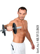 Man lifting a dumbbell. Стоковое фото, агентство Ingram Publishing / Фотобанк Лори