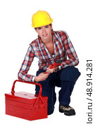 Tradeswoman holding a wrench. Стоковое фото, агентство Ingram Publishing / Фотобанк Лори