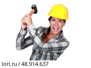 Woman construction worker getting mad. Стоковое фото, агентство Ingram Publishing / Фотобанк Лори