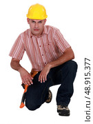 Portrait of a handyman frowning. Стоковое фото, агентство Ingram Publishing / Фотобанк Лори