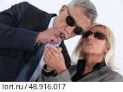 mature gentleman smoking cigar with blonde spouse showing off. Стоковое фото, агентство Ingram Publishing / Фотобанк Лори