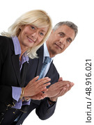 Business professionals clapping their hands. Стоковое фото, агентство Ingram Publishing / Фотобанк Лори