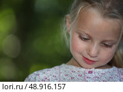 little blonde girl watching down look amused. Стоковое фото, агентство Ingram Publishing / Фотобанк Лори