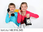 Child with broken phone. Стоковое фото, агентство Ingram Publishing / Фотобанк Лори