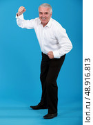 man in a suit dancing. Стоковое фото, агентство Ingram Publishing / Фотобанк Лори