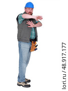 Scared male builder. Стоковое фото, агентство Ingram Publishing / Фотобанк Лори