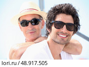Father and son wearing sunglasses. Стоковое фото, агентство Ingram Publishing / Фотобанк Лори