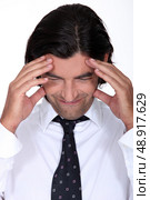 Man with a headache. Стоковое фото, агентство Ingram Publishing / Фотобанк Лори