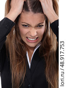 Businesswoman pulling hair out. Стоковое фото, агентство Ingram Publishing / Фотобанк Лори