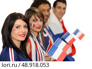 Group of French football supporters. Стоковое фото, агентство Ingram Publishing / Фотобанк Лори