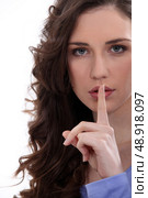 Brunette asking for quiet. Стоковое фото, агентство Ingram Publishing / Фотобанк Лори