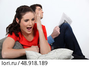 Woman watching a football game. Стоковое фото, агентство Ingram Publishing / Фотобанк Лори