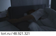 red haired middle aged woman trying to sleep, insomnia and sleep problems, stress at work. Стоковое видео, видеограф Арзюков Вадим Николаевич / Фотобанк Лори