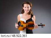 Woman artist with violin in music concept. Стоковое фото, агентство Ingram Publishing / Фотобанк Лори
